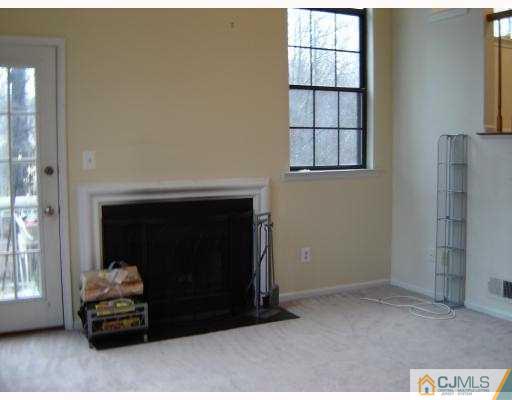 5002 Stonehedge Road Edison, NJ 08820 - Photo 4 of 7 a living room with furniture