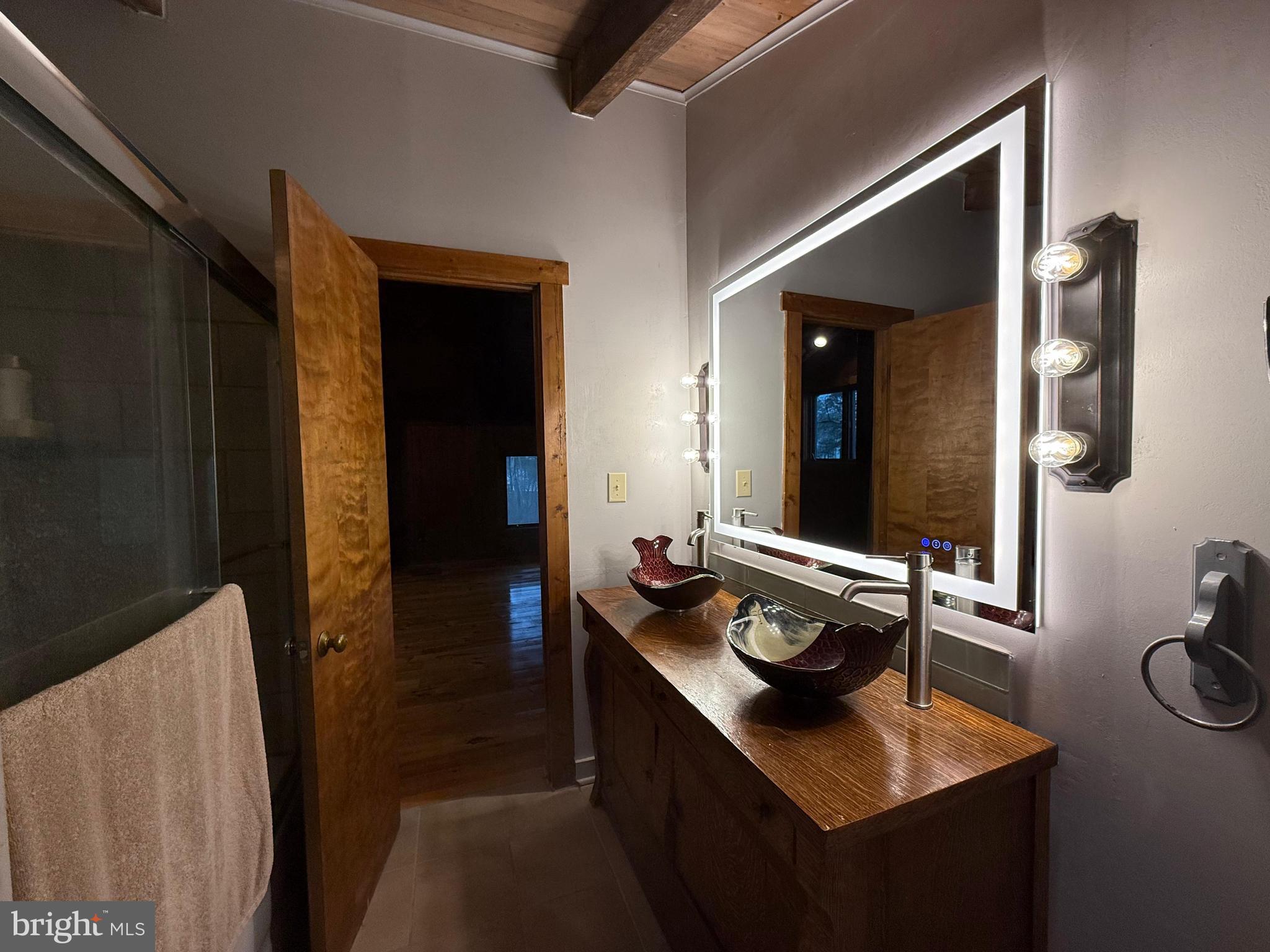 310 Brush Neck Road Susan, VA 23163 - Photo 28 of 70 a bathroom with sink and mirror