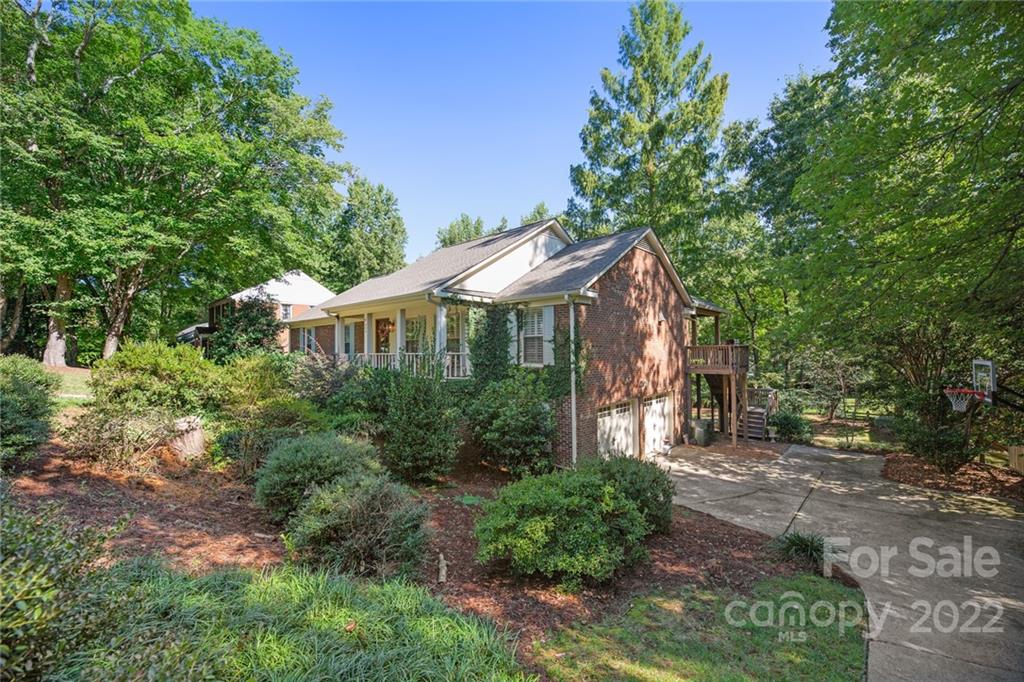620 Trail Ridge Road Matthews, NC 28105 - Photo 2 of 34 a view of a house with a yard