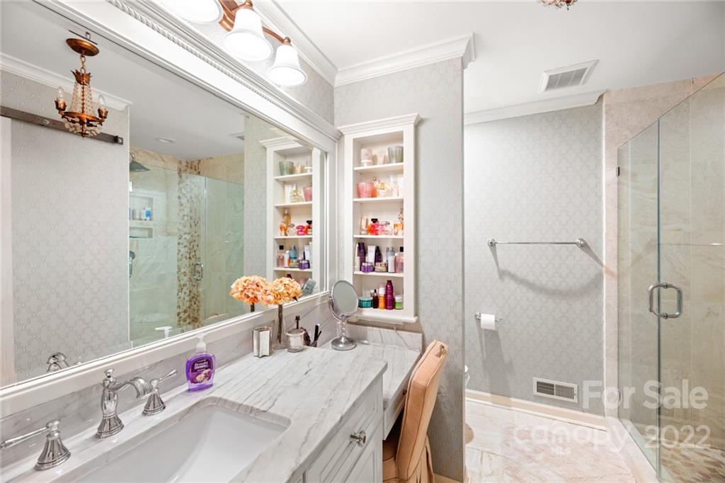 620 Trail Ridge Road Matthews, NC 28105 - Photo 22 of 34 a bathroom with a tub sink and mirror
