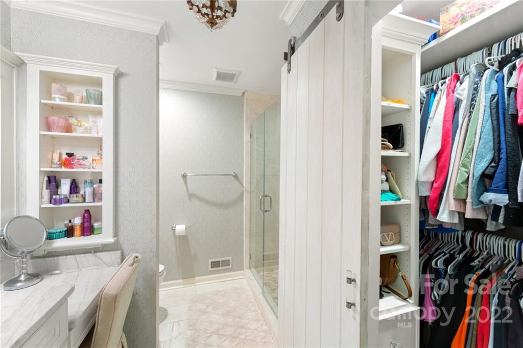 620 Trail Ridge Road Matthews, NC 28105 - Photo 23 of 34 a view of walk in closet with clothes and shoes