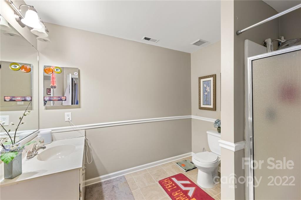 620 Trail Ridge Road Matthews, NC 28105 - Photo 29 of 34 a bathroom with a sink a toilet and shower