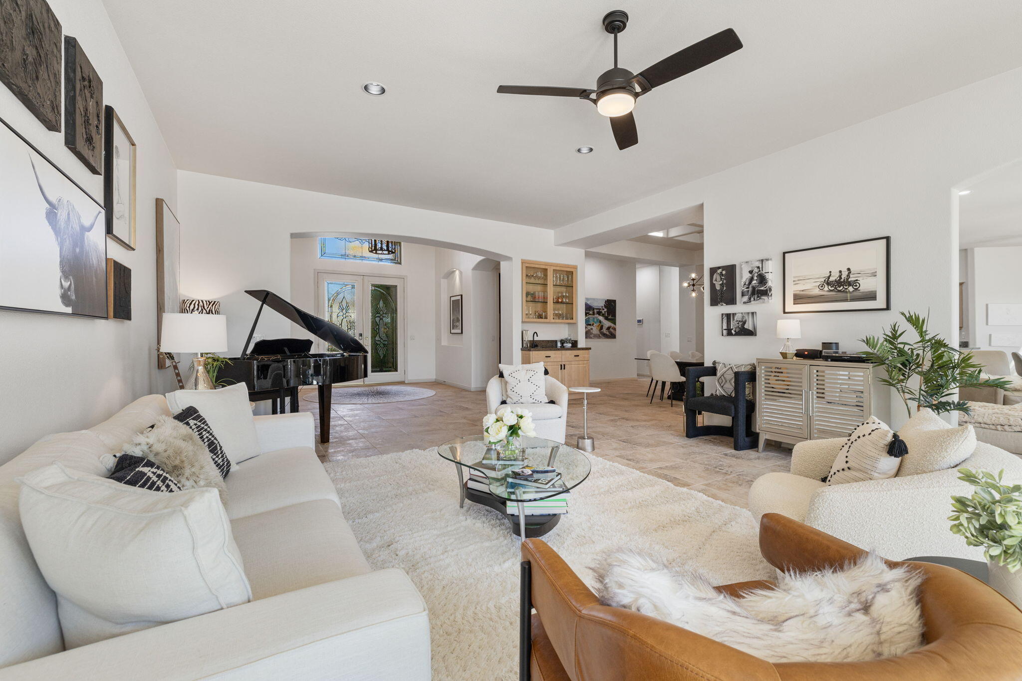19 Trafagar Square Rancho Mirage, CA 92270 - Photo 19 of 54 a living room with furniture and a chandelier