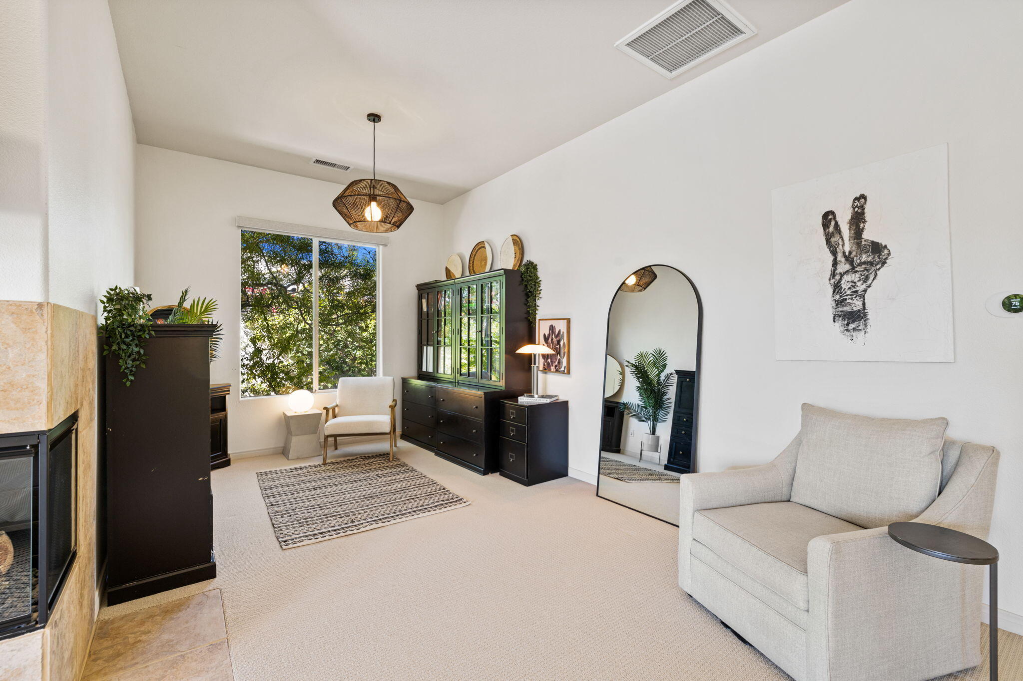 19 Trafagar Square Rancho Mirage, CA 92270 - Photo 29 of 54 a living room with furniture a chandelier and a window