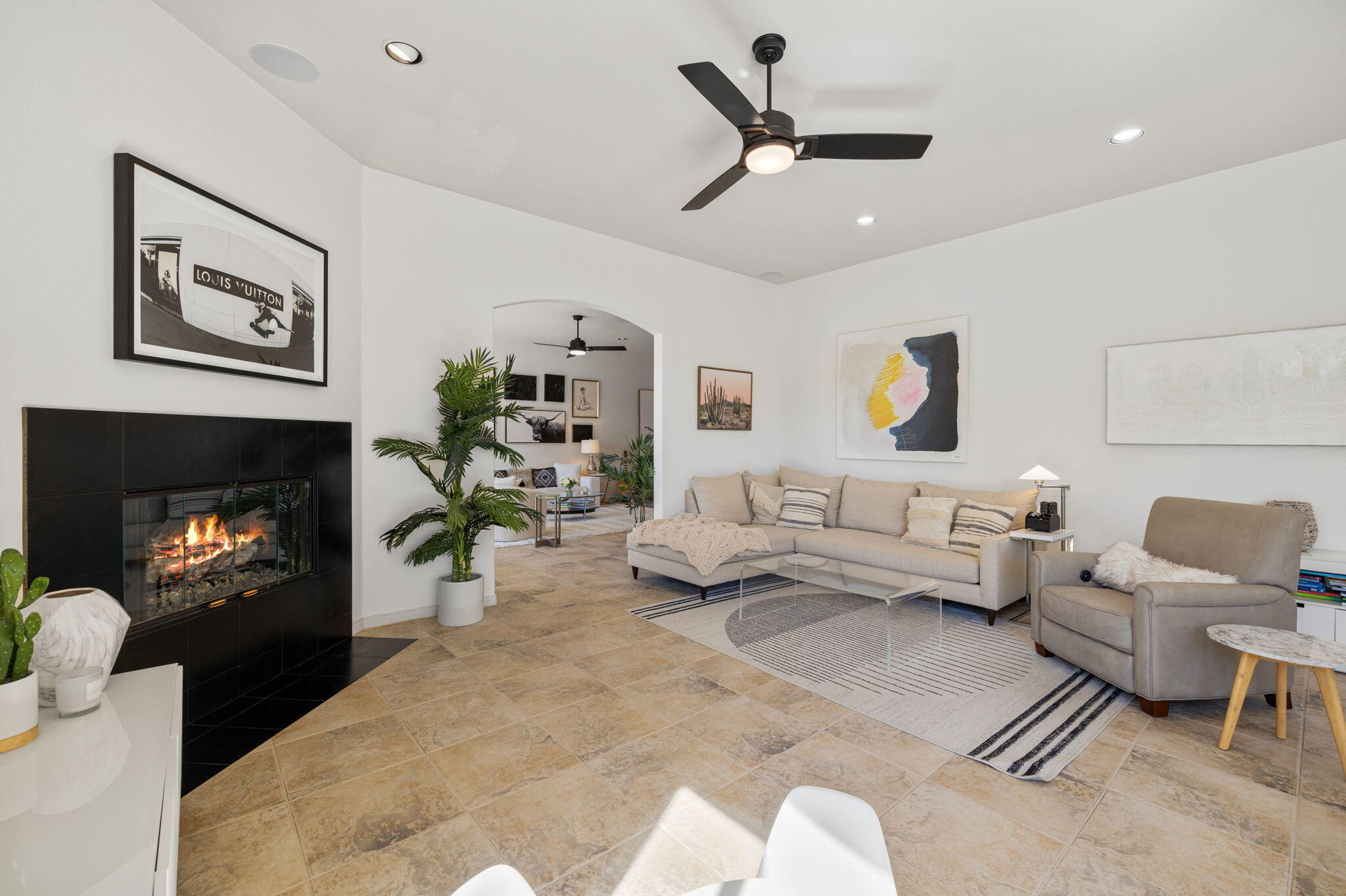 19 Trafagar Square Rancho Mirage, CA 92270 - Photo 36 of 54 a living room with furniture and a fireplace