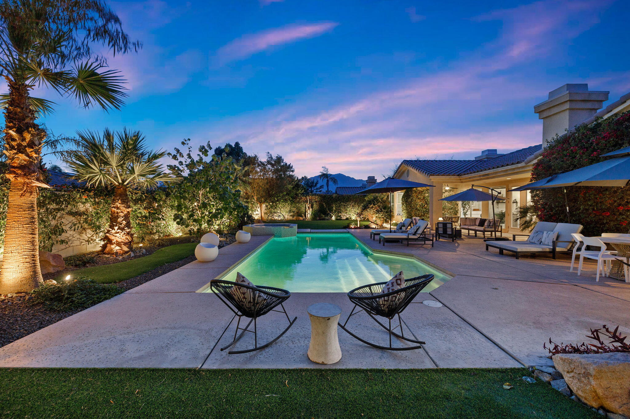 19 Trafagar Square Rancho Mirage, CA 92270 - Photo 47 of 54 a swimming pool with outdoor seating and yard