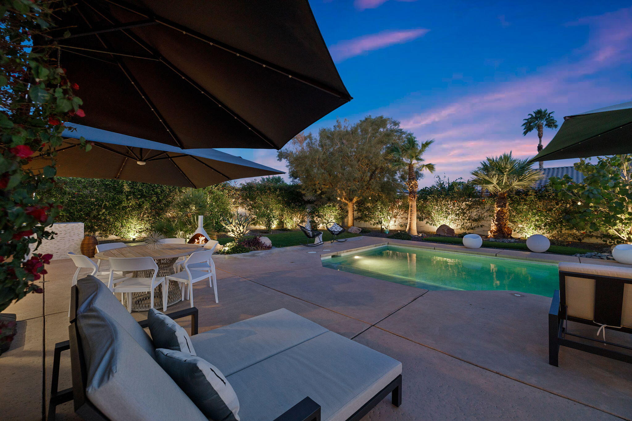 19 Trafagar Square Rancho Mirage, CA 92270 - Photo 48 of 54 a view of a backyard with sitting area