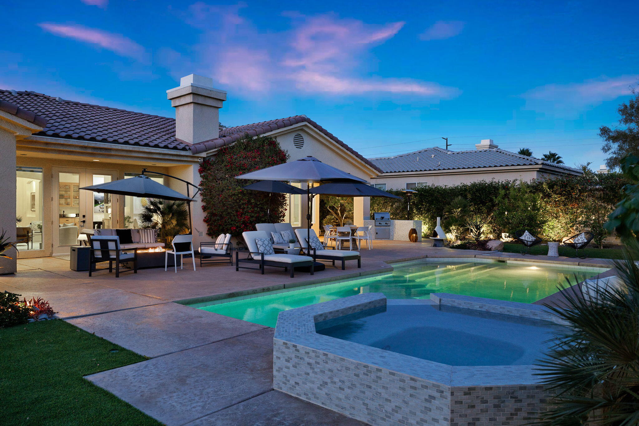 19 Trafagar Square Rancho Mirage, CA 92270 - Photo 50 of 54 a view of a house with backyard porch and sitting area