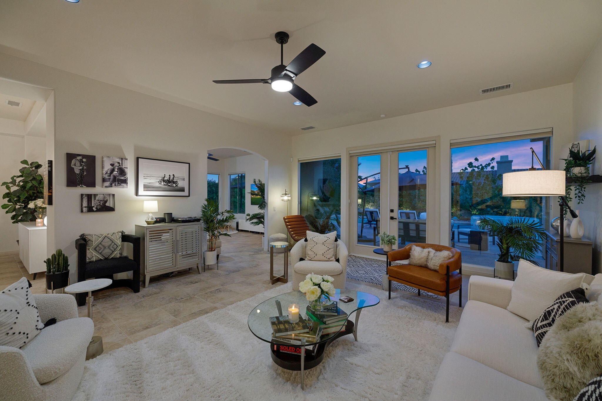 19 Trafagar Square Rancho Mirage, CA 92270 - Photo 53 of 54 a living room with furniture and a chandelier