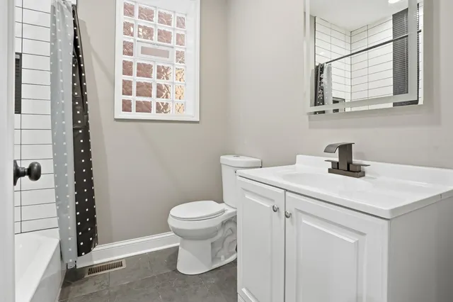 a bathroom with a sink and a toilet