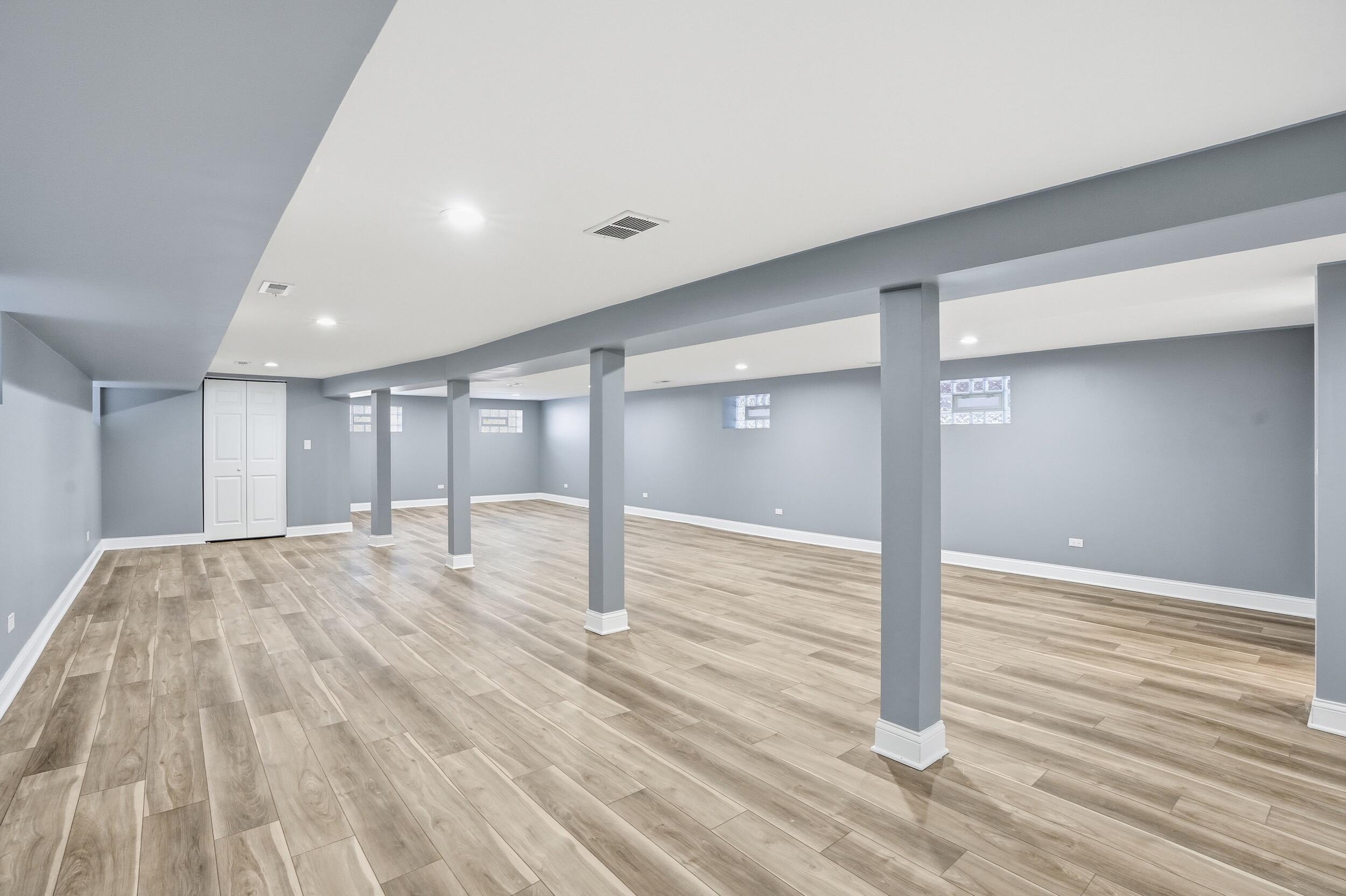 1320 Delaware Street Gary, IN 46407 - Photo 18 of 20 a view of an empty room and wooden floor