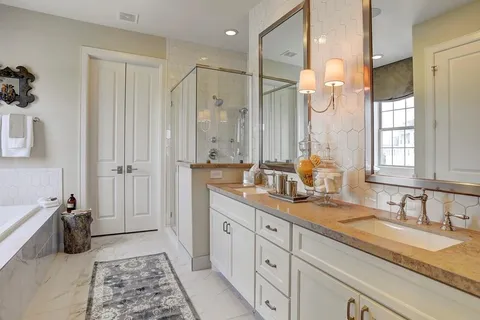 a bathroom with a double vanity sink mirror and double