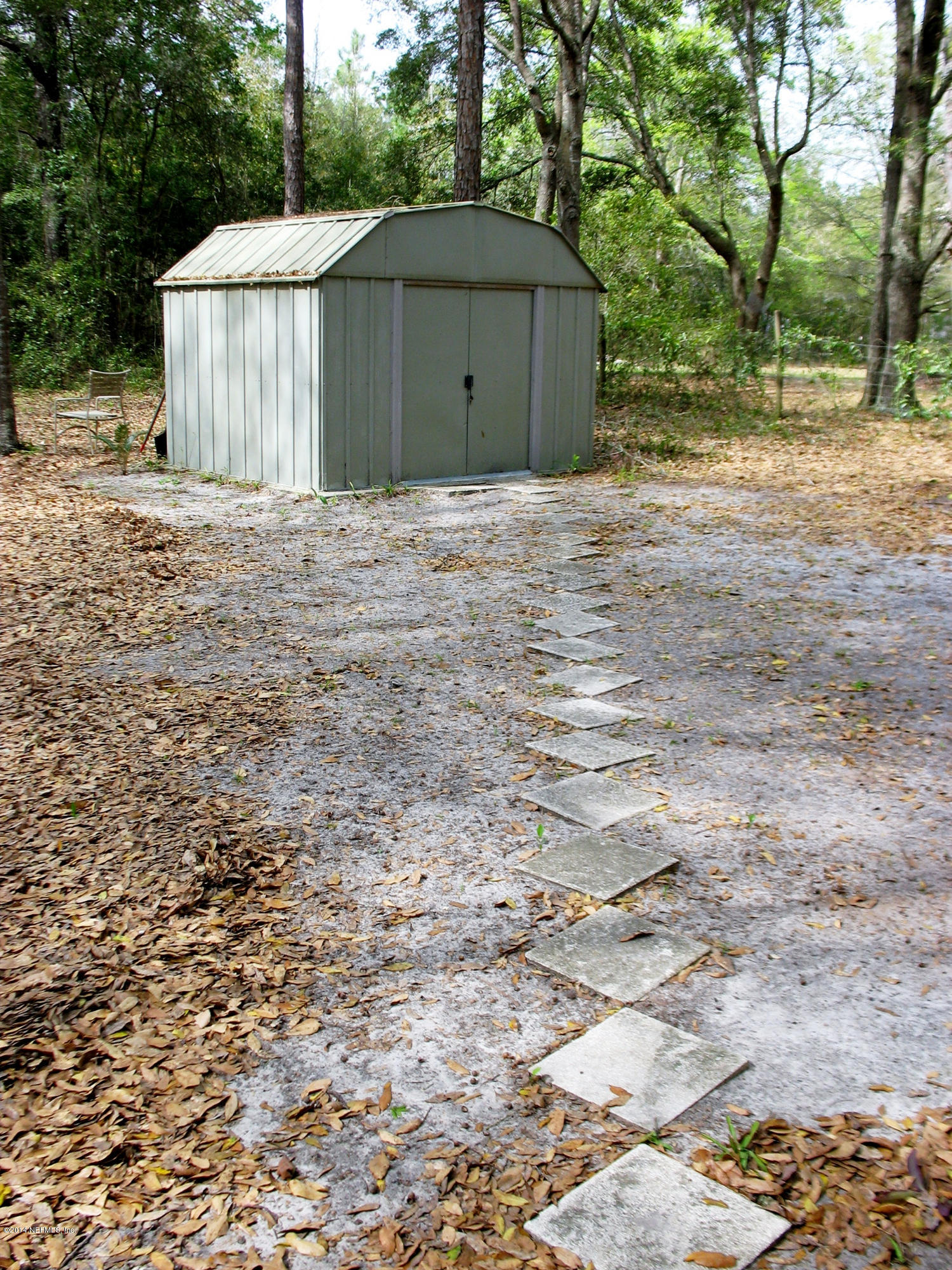 85163 Miner Road Yulee, FL 32097 - Photo 33 of 43 Pavered path to the storage shed