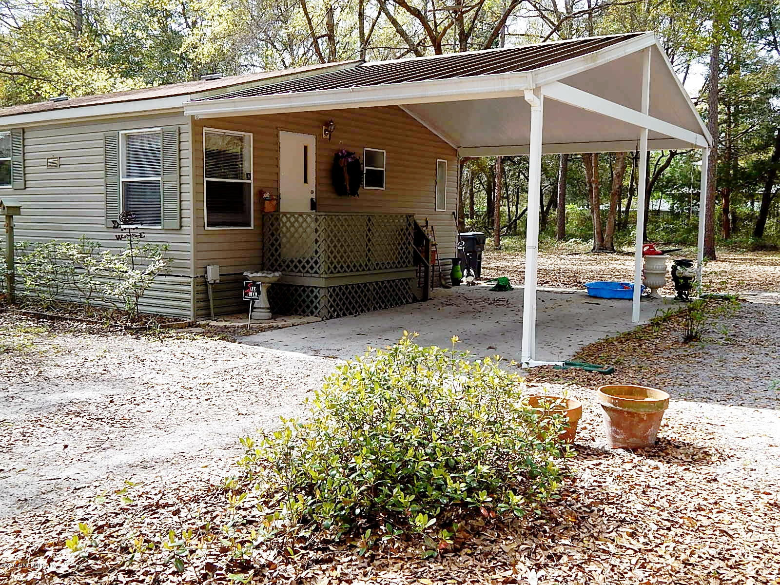 85163 Miner Road Yulee, FL 32097 - Photo 38 of 43 Carport with Metal Roof