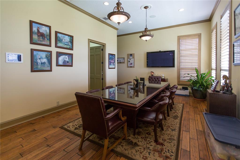 6800 Northwest 193rd Street Reddick, FL 32686 - Photo 13 of 65 a view of a dining room with furniture window and wooden floor
