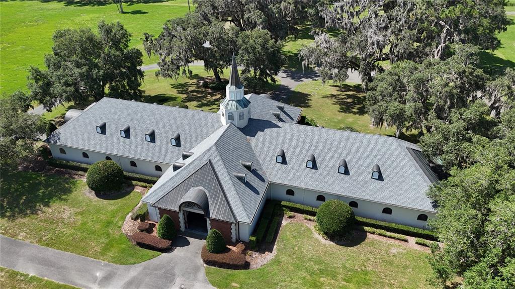 6800 Northwest 193rd Street Reddick, FL 32686 - Photo 28 of 65 an aerial view of a house with swimming pool and large trees