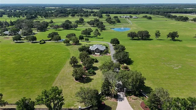 an aerial view of a golf course with chairs