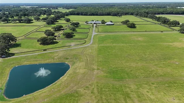 an aerial view of a house with outdoor space