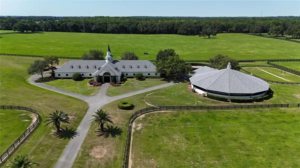an aerial view of a house with outdoor space