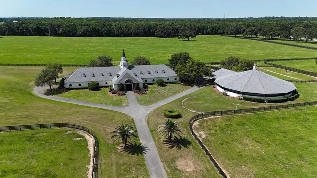 an aerial view of a houses with a lake view