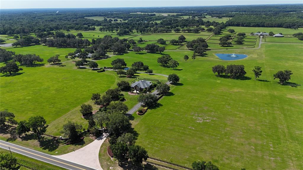 6800 Northwest 193rd Street Reddick, FL 32686 - Photo 6 of 65 an aerial view of a houses with outdoor space and trees