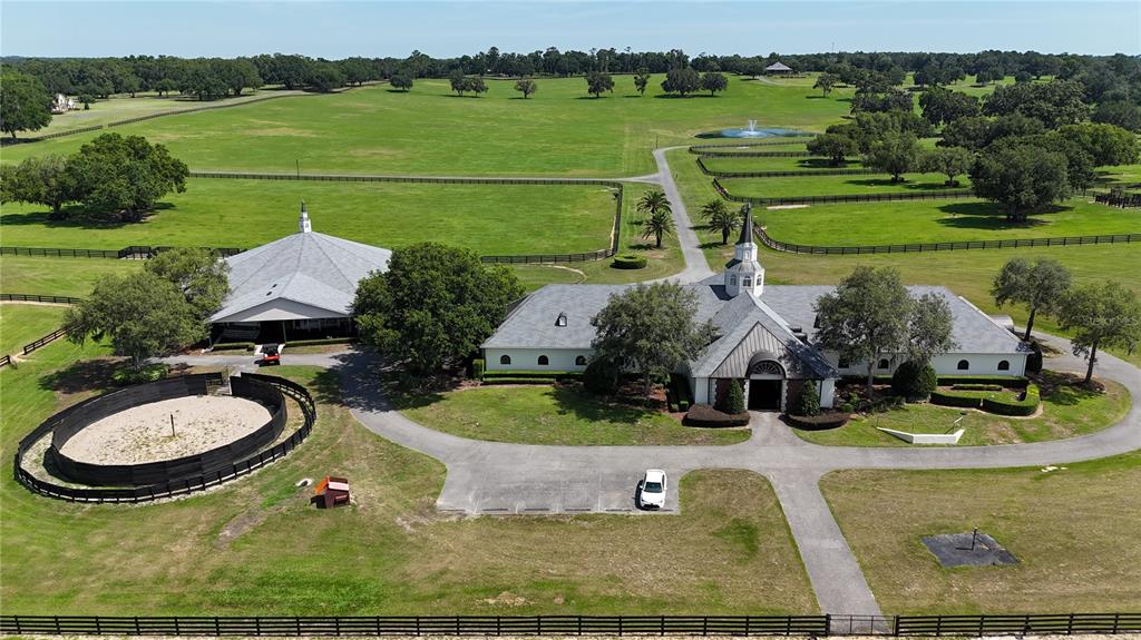 6800 Northwest 193rd Street Reddick, FL 32686 - Photo 61 of 65 an aerial view of a house with garden space and lake view