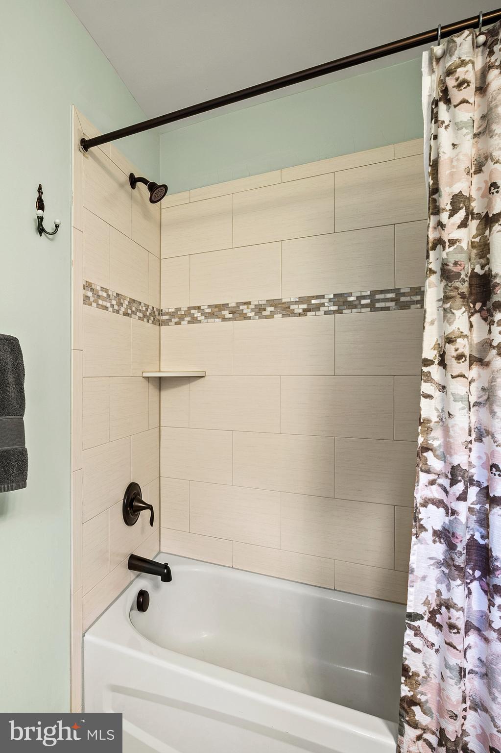 1760 Florence Road Mount Airy, MD 21771 - Photo 40 of 63 a bathroom with a shower and a bathtub