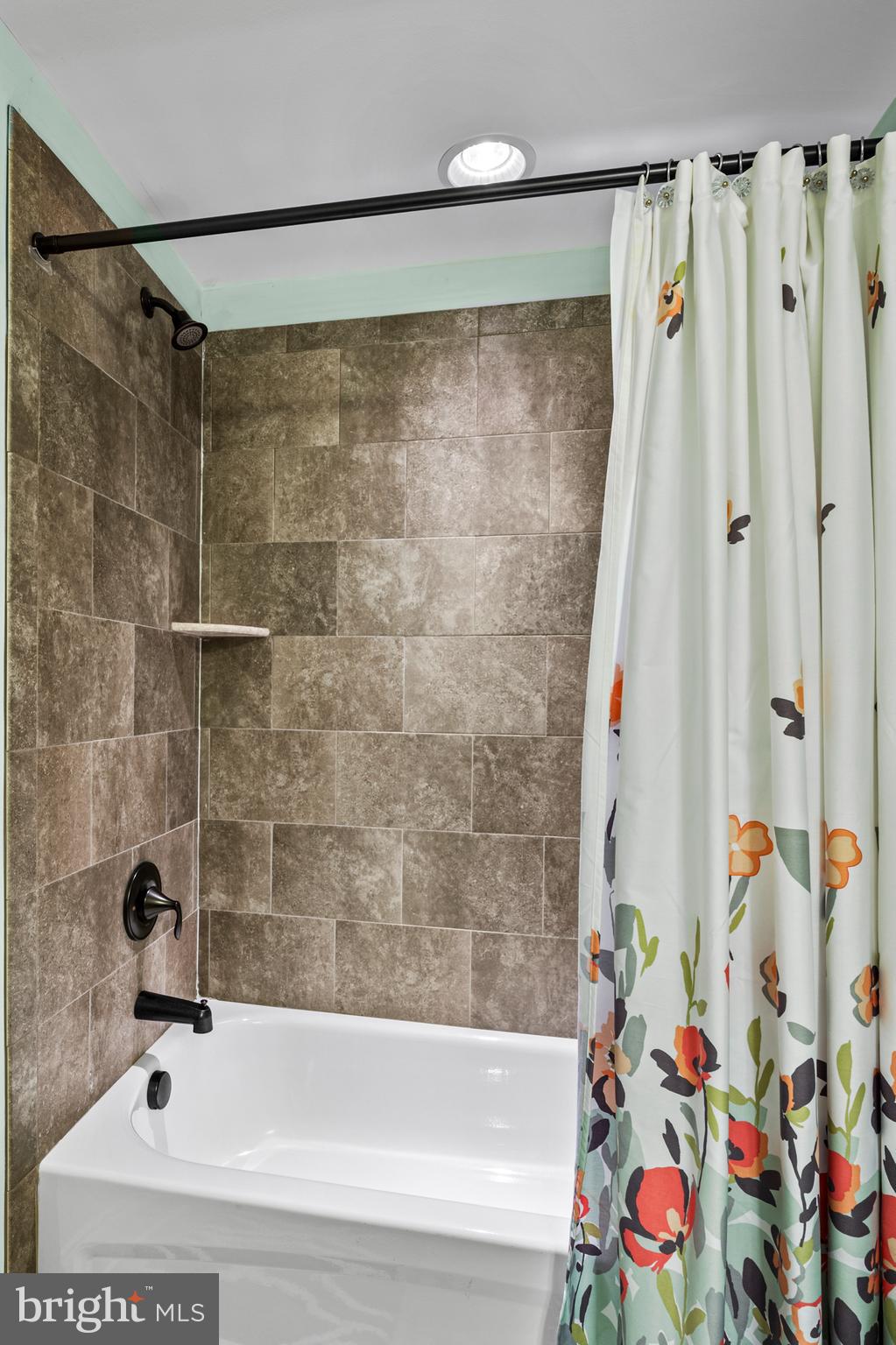 1760 Florence Road Mount Airy, MD 21771 - Photo 48 of 63 a bathroom with a bathtub and shower