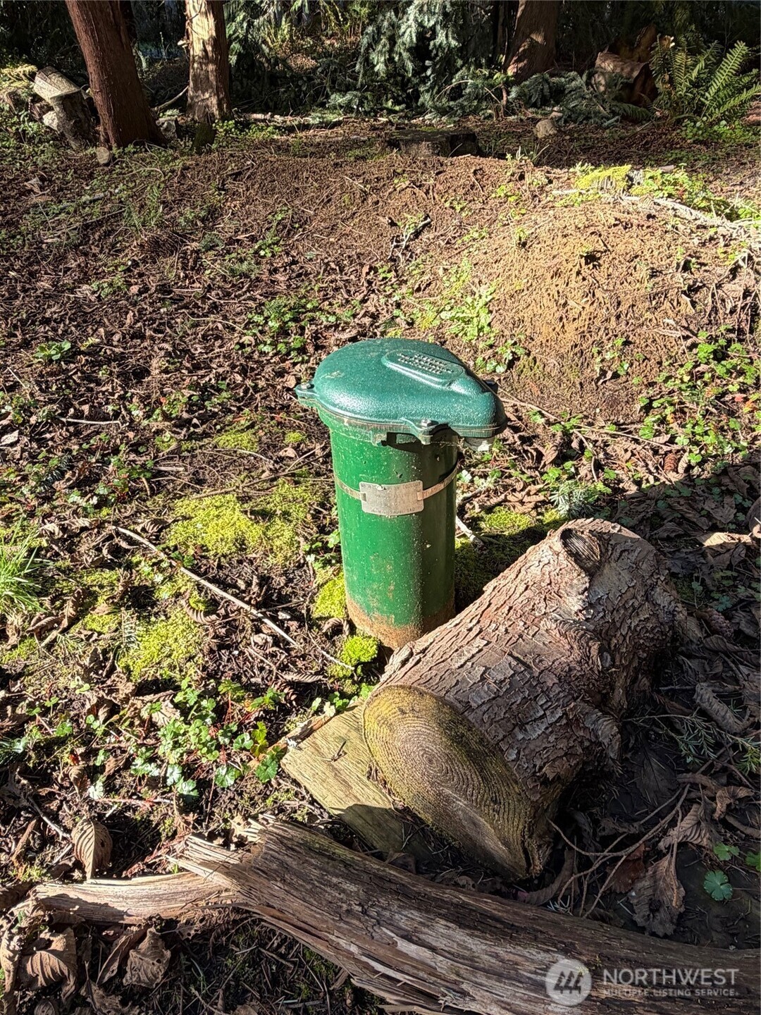 4843 Northeast Twin Spits Road Hansville, WA 98340 - Photo 9 of 20 a view of a backyard of the house