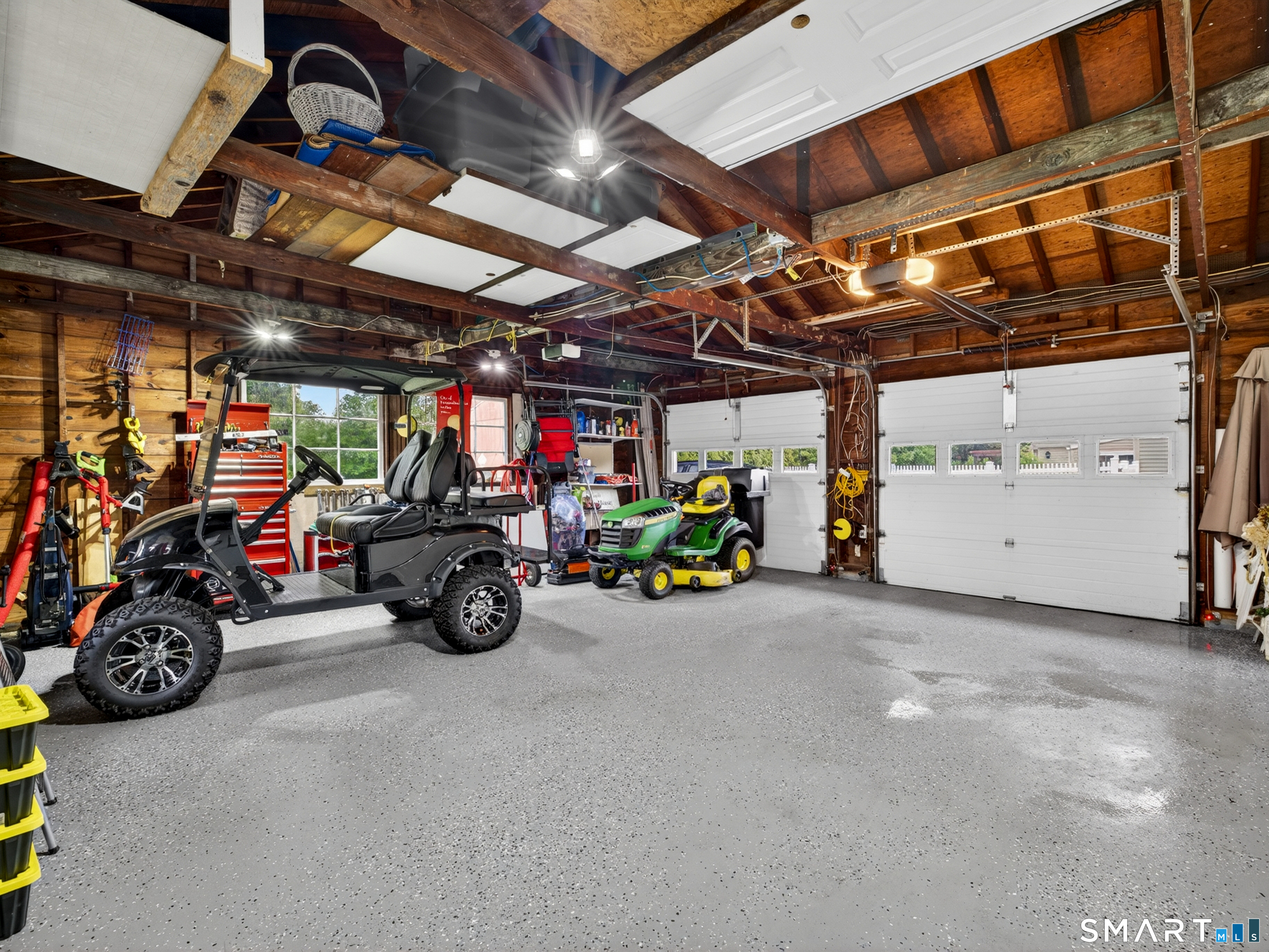235 Scotland Road Norwich, CT 06360 - Photo 5 of 31 a view of a garage with a bike and wooden roof