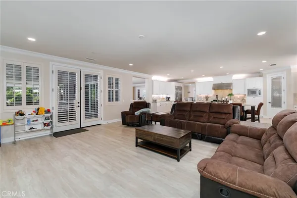 a large room with lots of counter space and painting on the wall