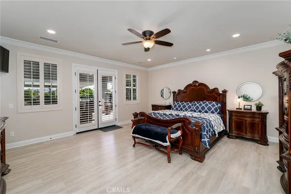 a bathroom with a double vanity sink toilet mirror and shower
