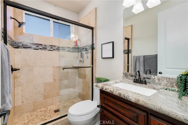 an aerial view of house with yard