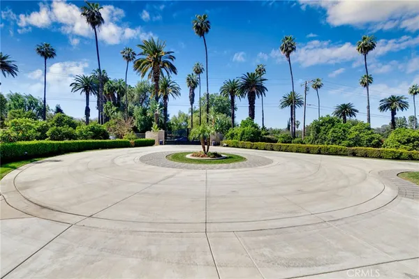 a view of a white house with a yard