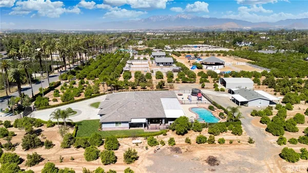 a bathroom with a double vanity sink toilet and mirror