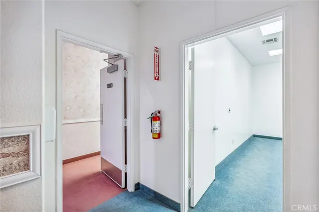 a view of a dining room with furniture and a window