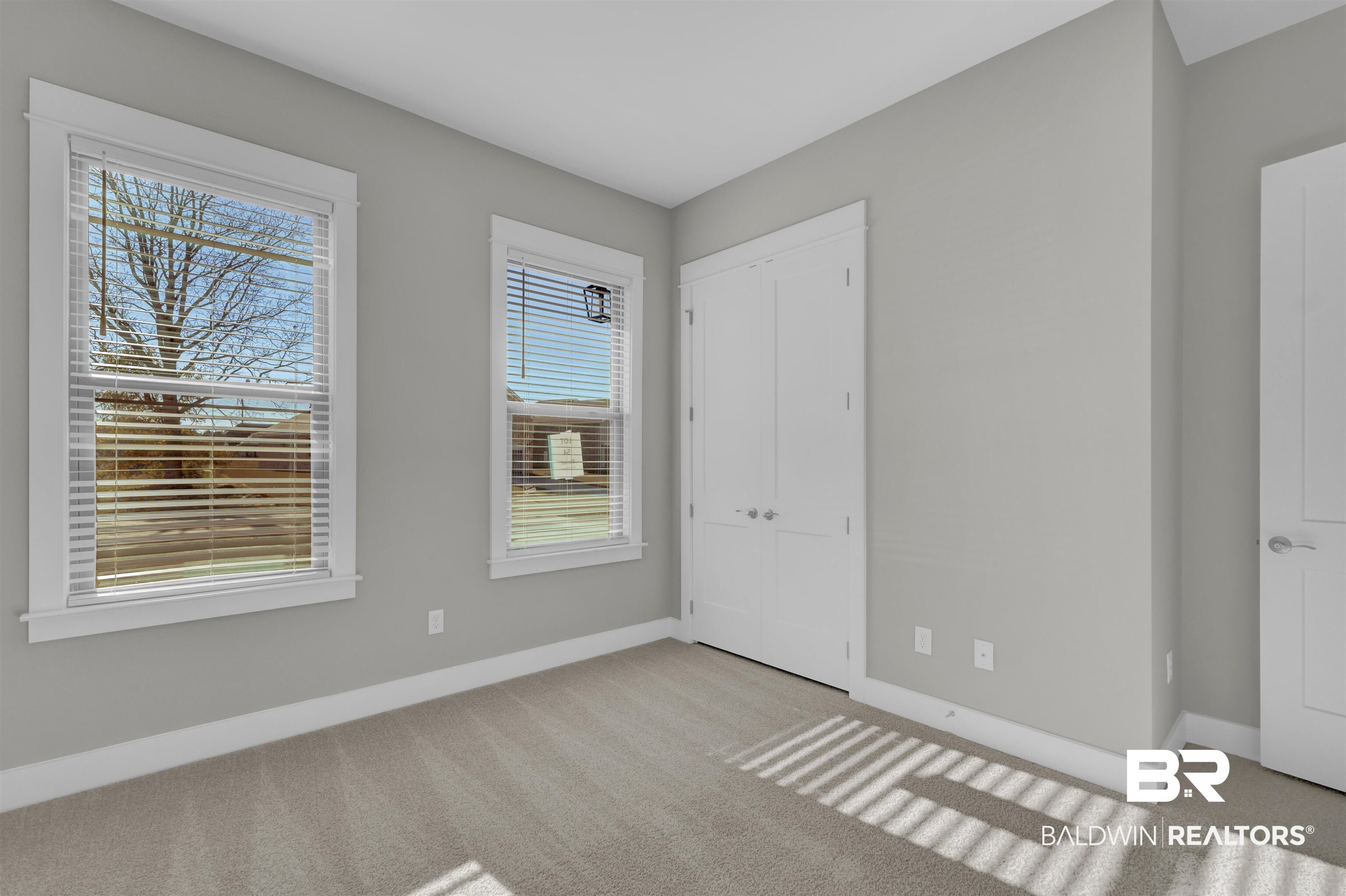 571 Morning Mist Way Fairhope, AL 36532 - Photo 30 of 47 Unfurnished bedroom with a closet and light carpet