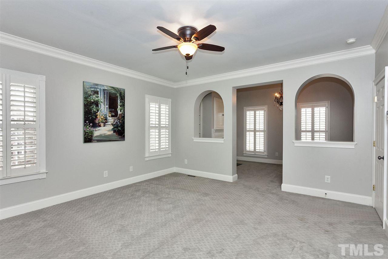 2001 Angelwing Court Raleigh, NC 27613 - Photo 14 of 23 an empty room with windows and ceiling fan