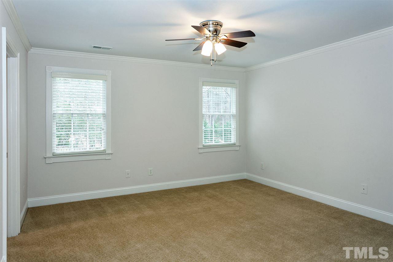 2001 Angelwing Court Raleigh, NC 27613 - Photo 23 of 23 an empty room with windows and fan