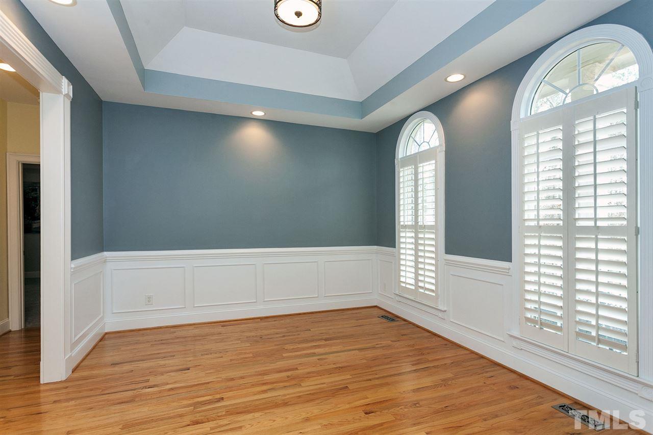 2001 Angelwing Court Raleigh, NC 27613 - Photo 7 of 23 a view of empty room with wooden floor and fan