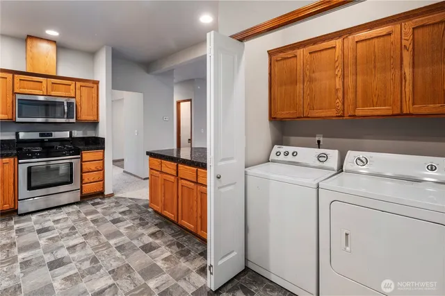 a kitchen that has a sink and a stove top oven