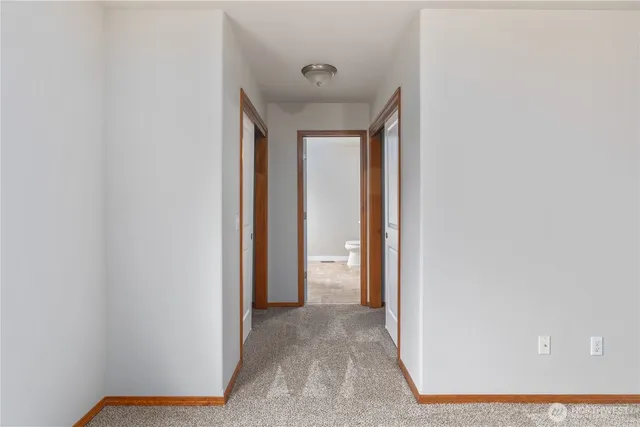a view of a hallway with closet