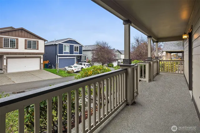 a balcony view with an outdoor seating