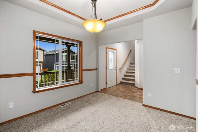 a view of a hallway with a chandelier
