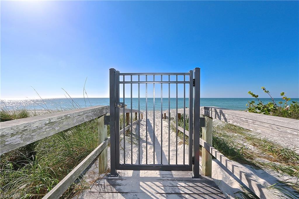 60 Seagate Drive, Unit 406 Naples, FL 34103 - Photo 23 of 26 a view of balcony with wooden floor
