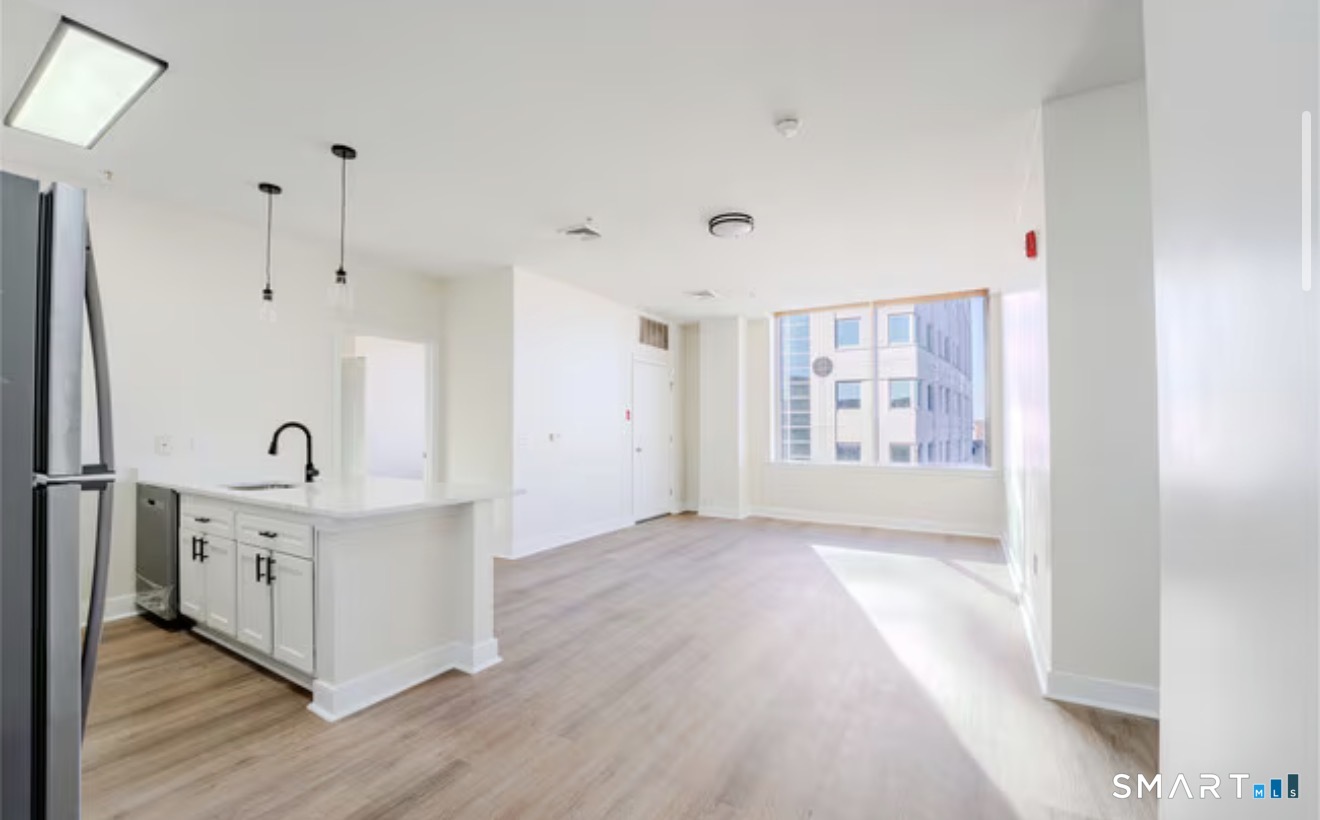 333 State Street, Unit 410 Bridgeport, CT 06604 - Photo 3 of 6 a view of a kitchen with electric appliances
