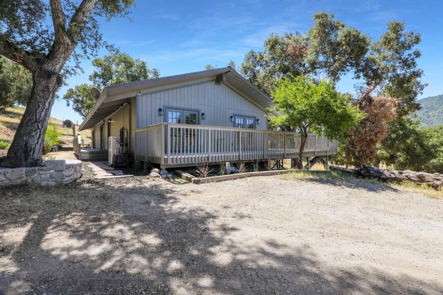 19235 Cachagua Road Carmel Valley, CA 93924 - Photo 1 of 34 a view of a house with a yard covered in snow