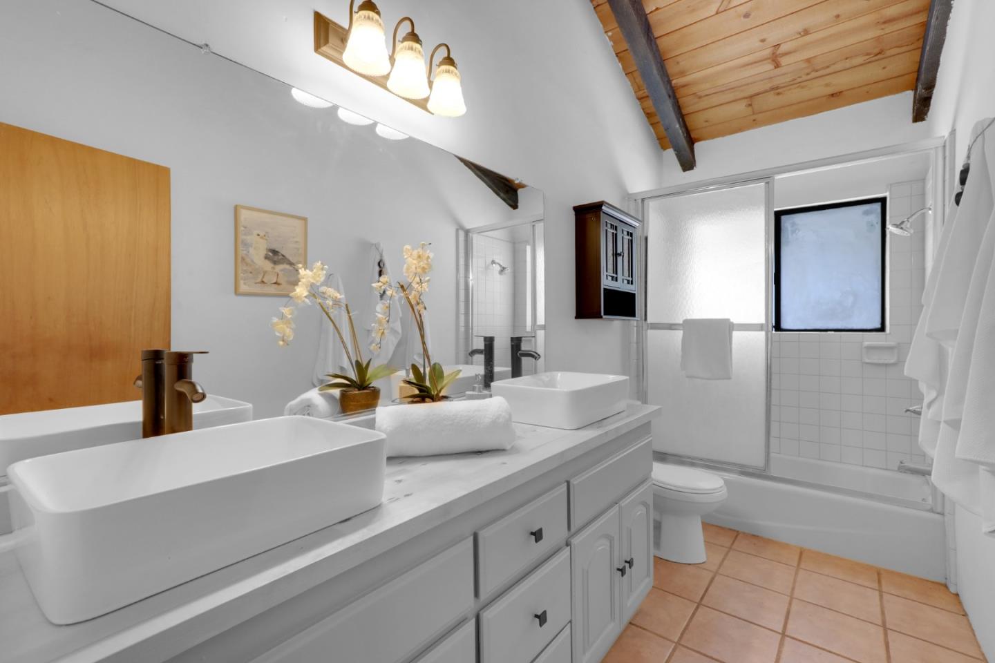 19235 Cachagua Road Carmel Valley, CA 93924 - Photo 12 of 34 a bathroom with a sink and a mirror