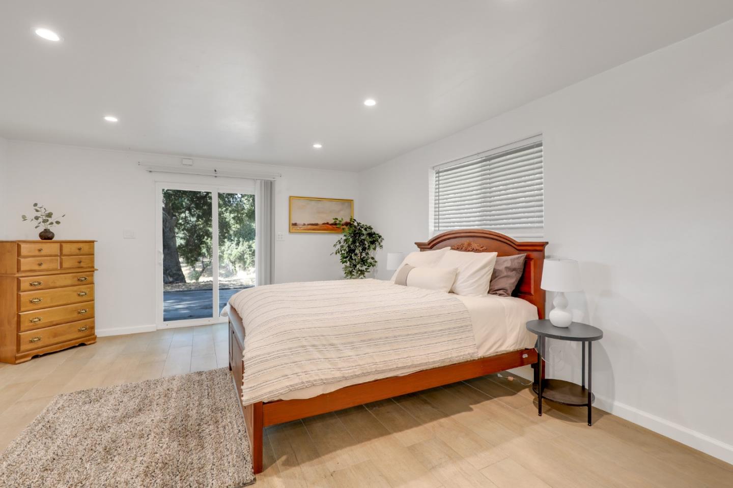 19235 Cachagua Road Carmel Valley, CA 93924 - Photo 27 of 34 a bedroom with a bed and a dresser