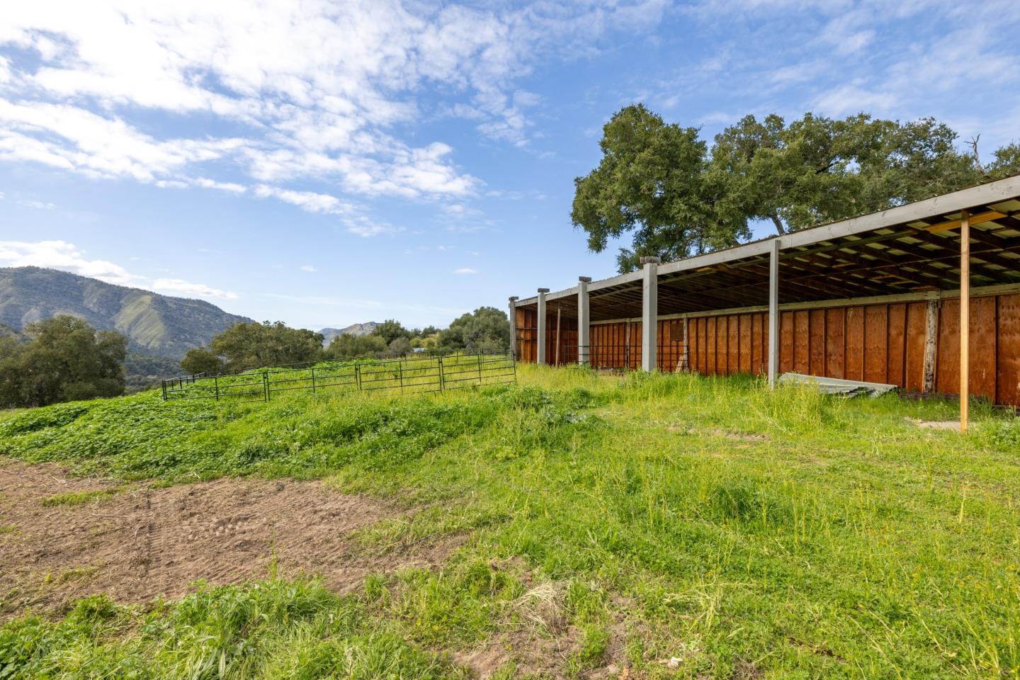 19235 Cachagua Road Carmel Valley, CA 93924 - Photo 33 of 34 a backyard of a house with lots of green space